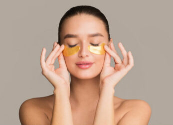 Woman with gold under eye patches